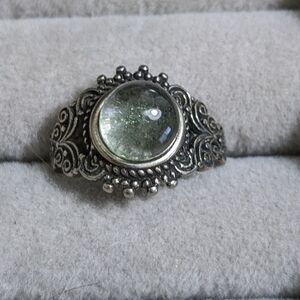 Elegant Silver-Toned Ring with Green Gemstone
